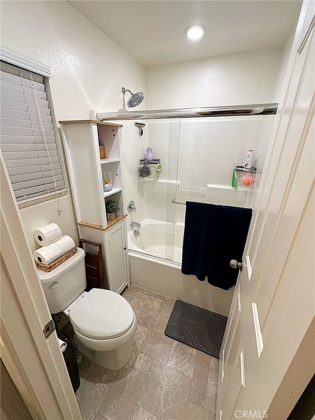 full bath with toilet, enclosed tub / shower combo, stone tile floors, and recessed lighting