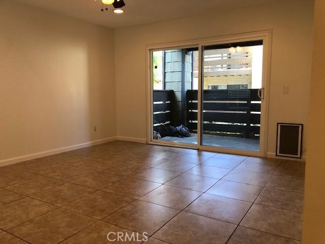 tiled spare room with baseboards