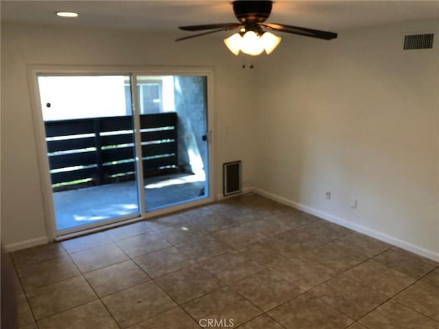 tiled spare room featuring a ceiling fan, recessed lighting, visible vents, and baseboards