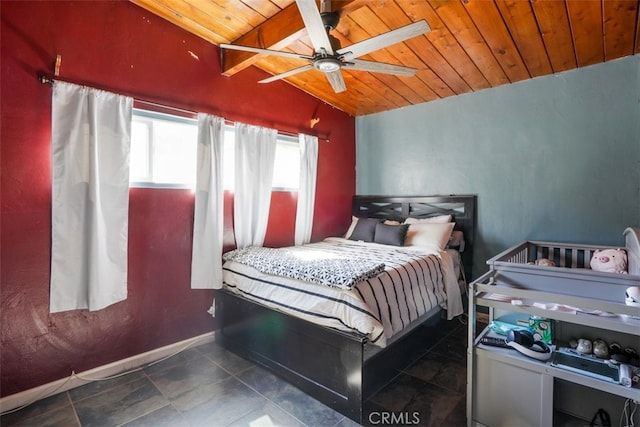 bedroom with baseboards, a ceiling fan, wood ceiling, tile patterned flooring, and vaulted ceiling