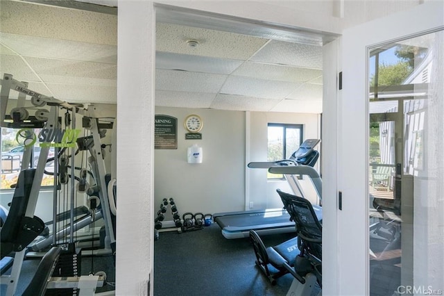 gym featuring a paneled ceiling