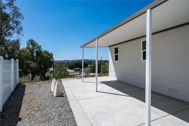 view of patio / terrace featuring fence