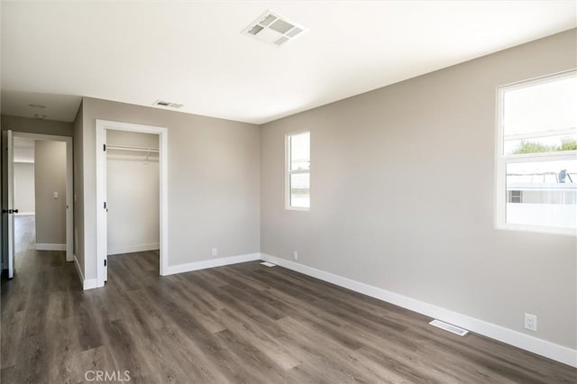 unfurnished bedroom with visible vents and baseboards