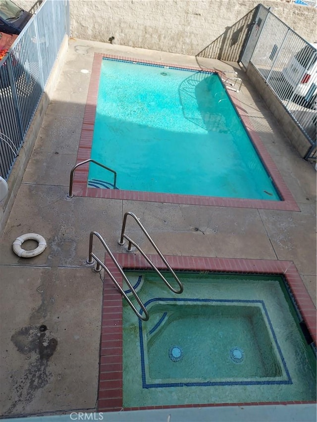 view of pool with fence