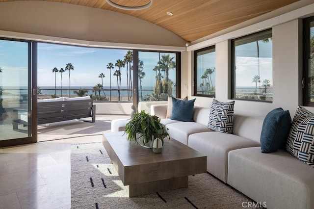 sunroom / solarium with a water view, wood ceiling, and vaulted ceiling