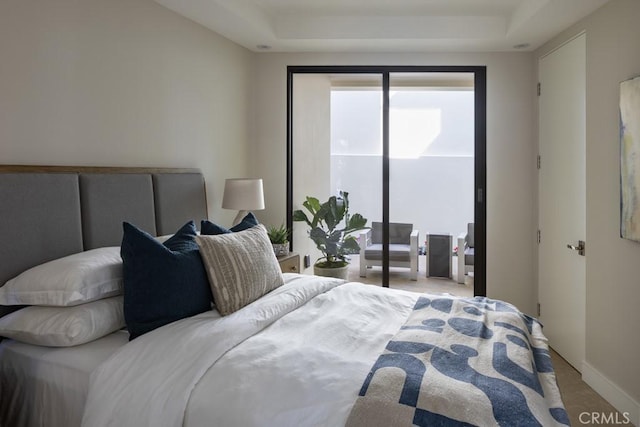 bedroom featuring access to exterior, carpet floors, and baseboards