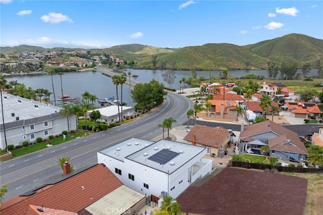 drone / aerial view with a residential view and a water and mountain view