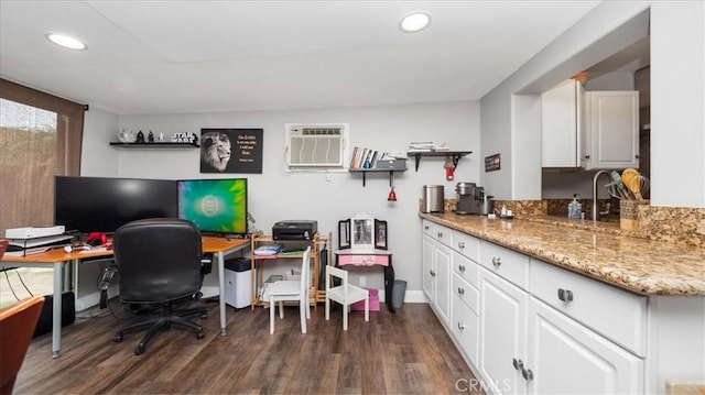 office area featuring dark wood-style floors, a wall unit AC, baseboards, and recessed lighting