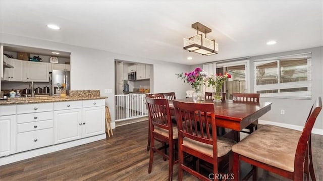 dining area featuring baseboards, dark wood-type flooring, and recessed lighting