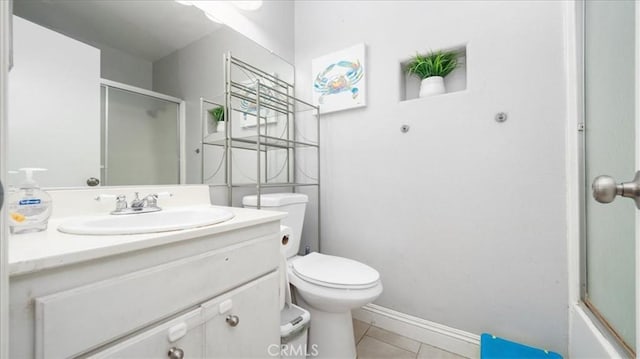 full bath with baseboards, vanity, toilet, and tile patterned floors