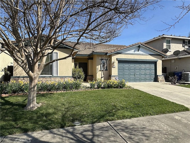 view of front of home featuring stone siding, an attached garage, driveway, and a front yard