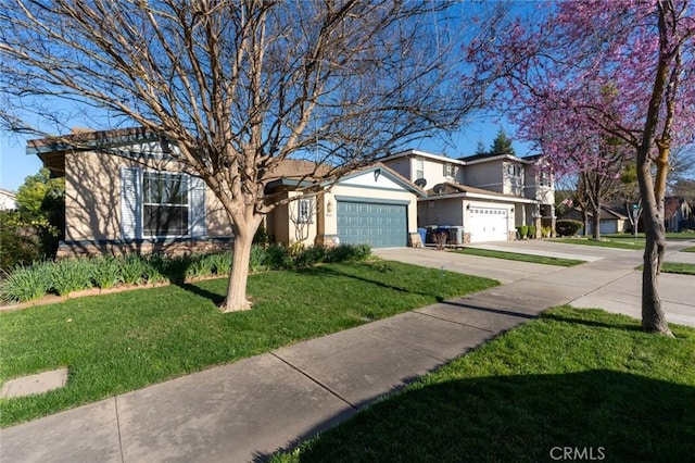 view of front of house featuring concrete driveway, a front yard, and stucco siding