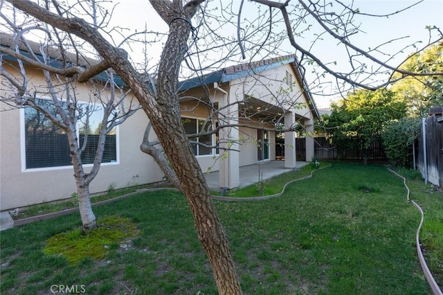 view of yard with a patio area and fence