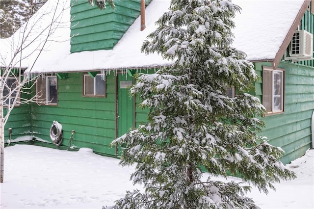 view of snow covered exterior featuring a patio