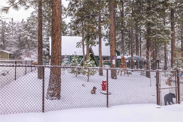 view of community featuring fence and a playground