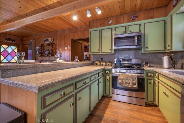 kitchen with stainless steel appliances, wooden ceiling, a peninsula, and green cabinets