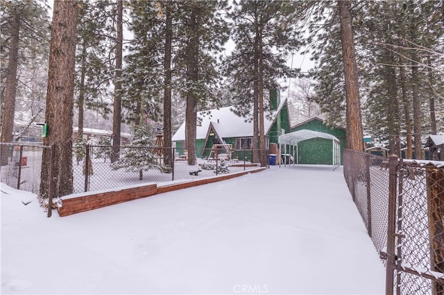 exterior space with a playground and fence