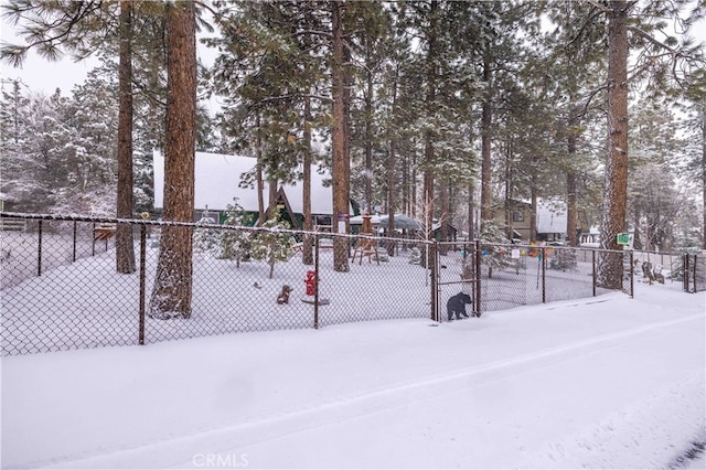 snowy yard with fence