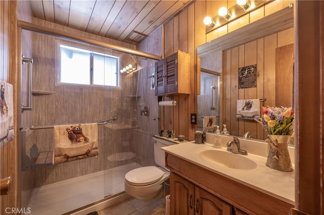 bathroom with toilet, a stall shower, tile patterned flooring, and vanity