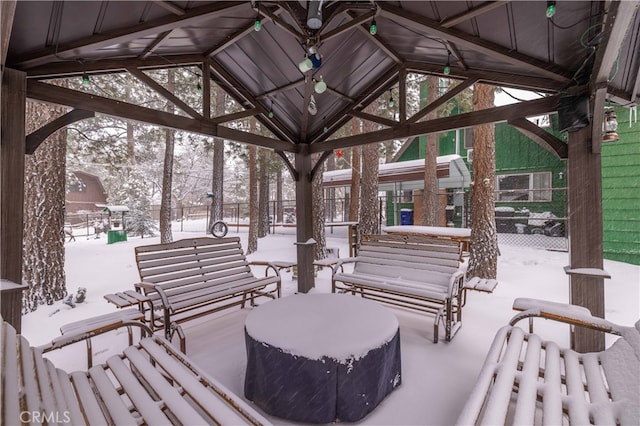 view of home's community with an outdoor hangout area, a gazebo, and fence