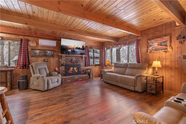 living room with a fireplace, wood finished floors, wood ceiling, a wall mounted AC, and beamed ceiling