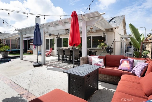 view of patio featuring an outdoor living space, a trampoline, and a pergola