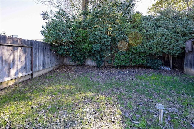 view of yard with a fenced backyard