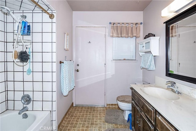 full bathroom with  shower combination, vanity, and toilet