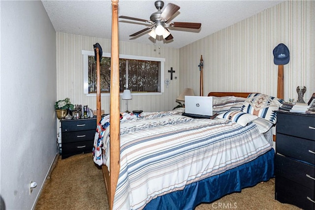 carpeted bedroom with wallpapered walls, ceiling fan, baseboards, and a textured ceiling