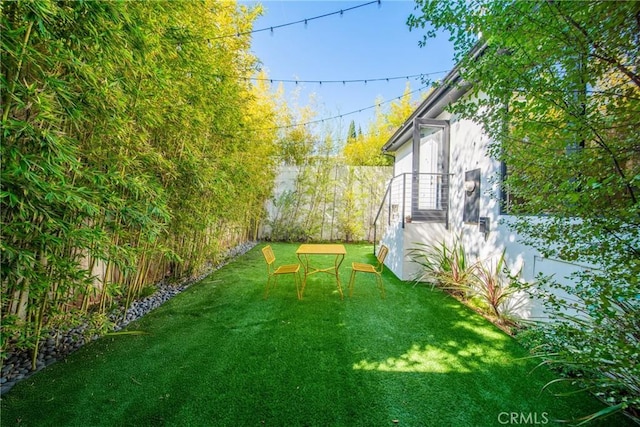 view of yard featuring fence