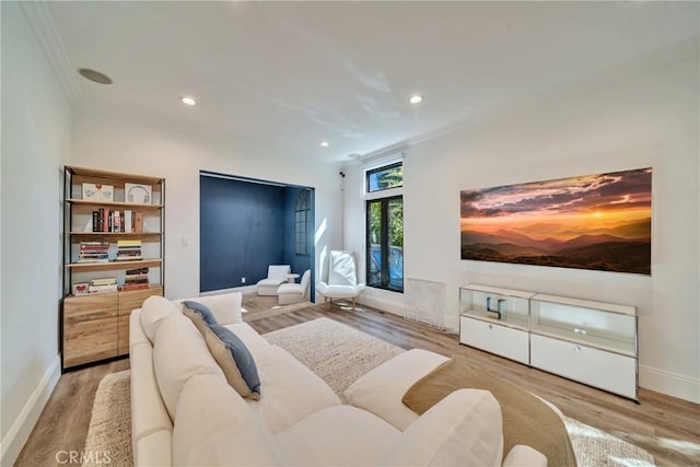 bedroom with baseboards, recessed lighting, wood finished floors, and crown molding