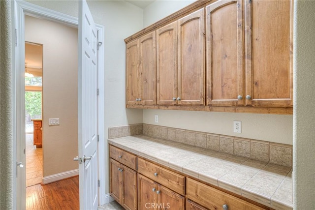 kitchen featuring light wood finished floors and baseboards