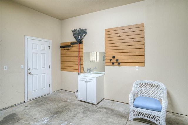 clothes washing area featuring a sink