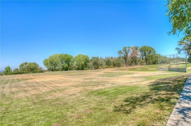 view of yard with a rural view