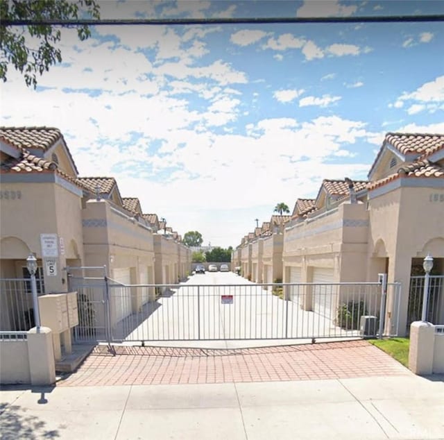 view of gate featuring a residential view