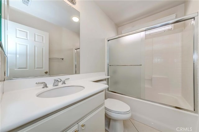 full bath featuring toilet, shower / bath combination with glass door, visible vents, and vanity