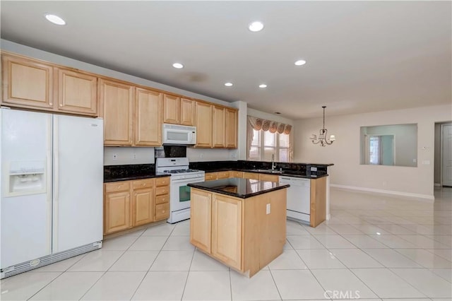 kitchen with light brown cabinets, white appliances, a kitchen island, and a sink