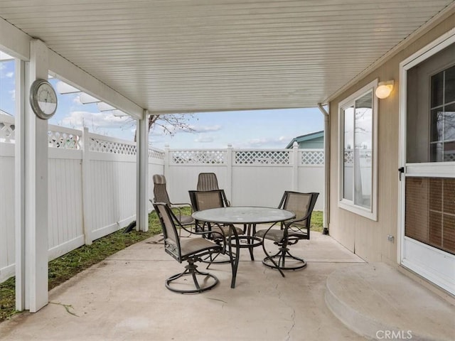 view of patio / terrace with a fenced backyard and outdoor dining space