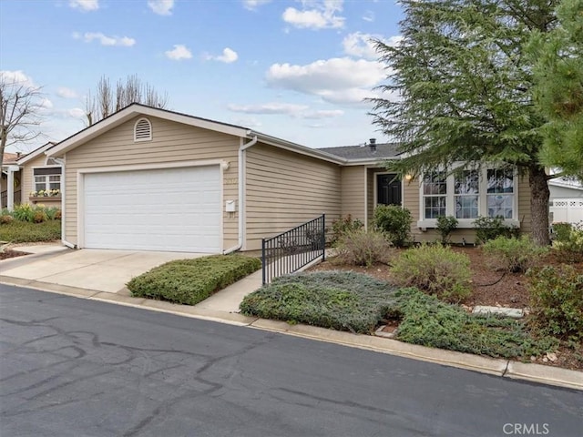 view of front of house featuring a garage and driveway