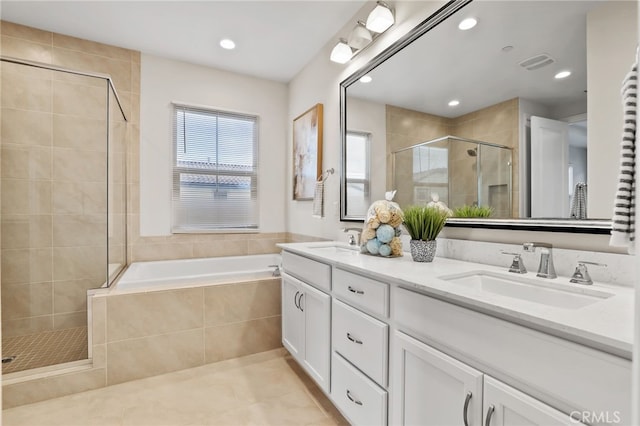 full bathroom featuring a stall shower, tile patterned flooring, visible vents, and a sink