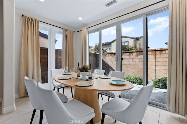 dining room featuring light tile patterned floors, visible vents, and recessed lighting