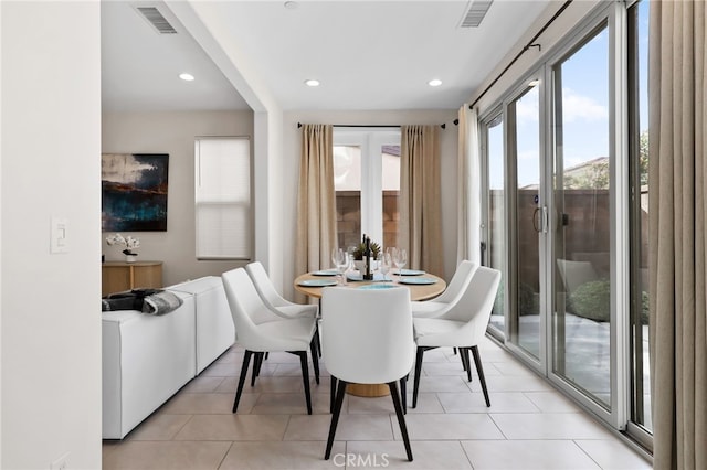 dining space with recessed lighting, visible vents, and light tile patterned flooring