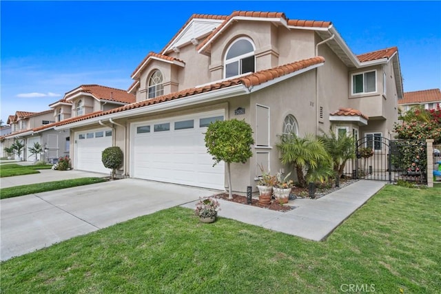 mediterranean / spanish home featuring concrete driveway, stucco siding, a tile roof, fence, and a front yard