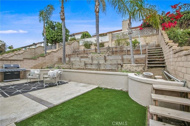 view of yard with fence, stairway, and a patio