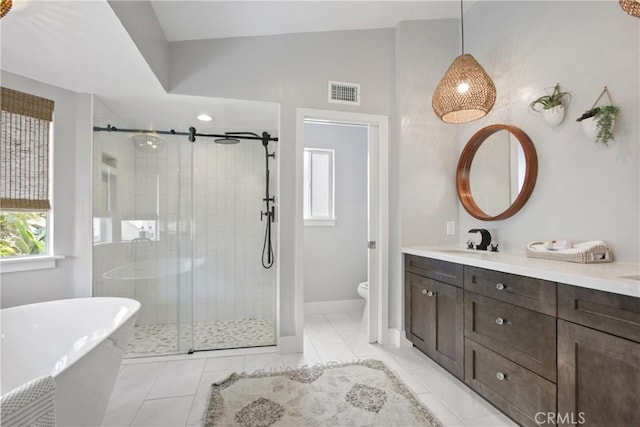 full bath featuring a soaking tub, visible vents, toilet, a stall shower, and vanity