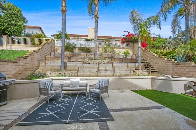 view of patio with an outdoor hangout area, fence, and a grill