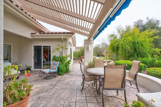 view of patio / terrace featuring outdoor dining area and a pergola