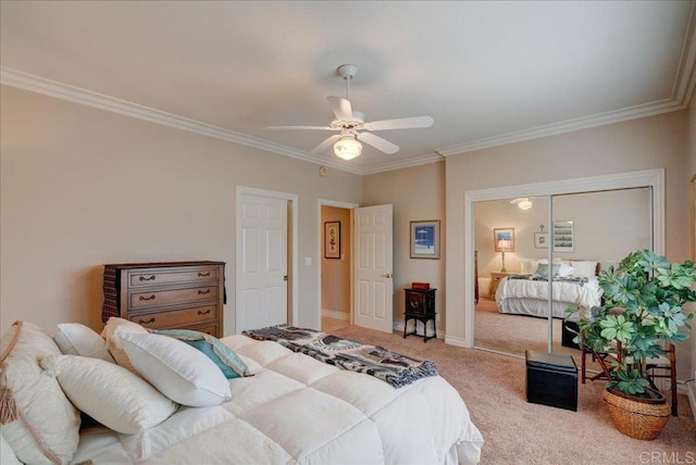 carpeted bedroom with a ceiling fan, baseboards, and crown molding