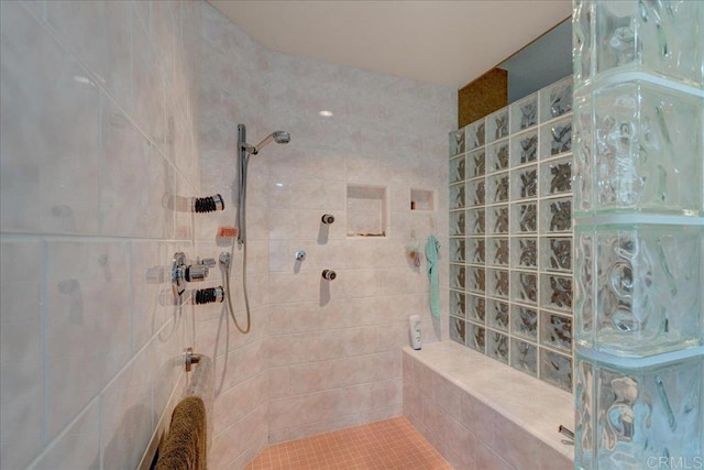 bathroom with a tile shower