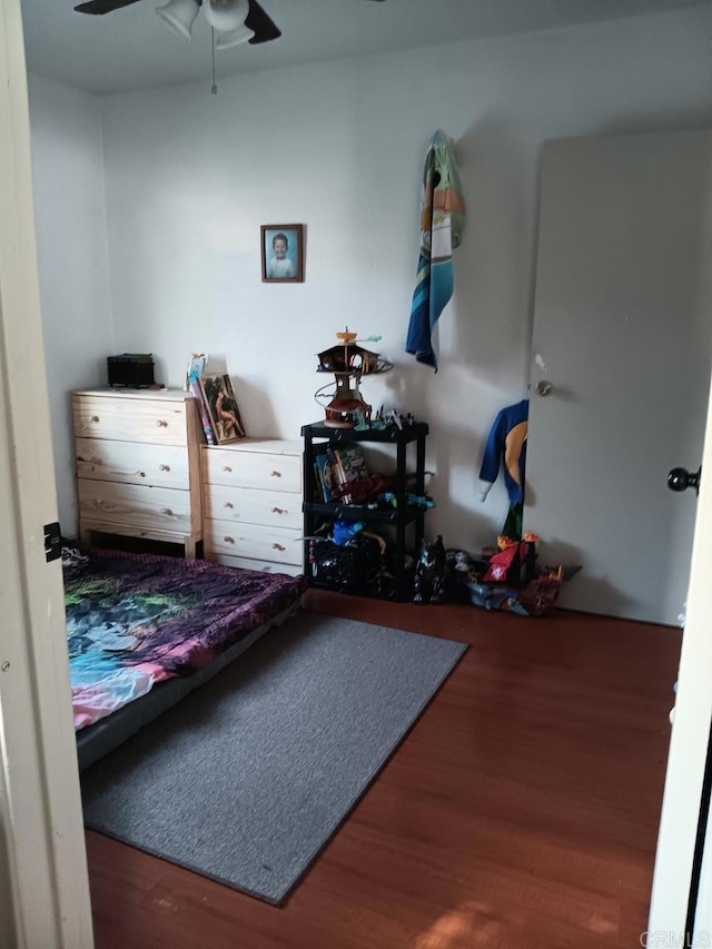 bedroom with ceiling fan and wood finished floors